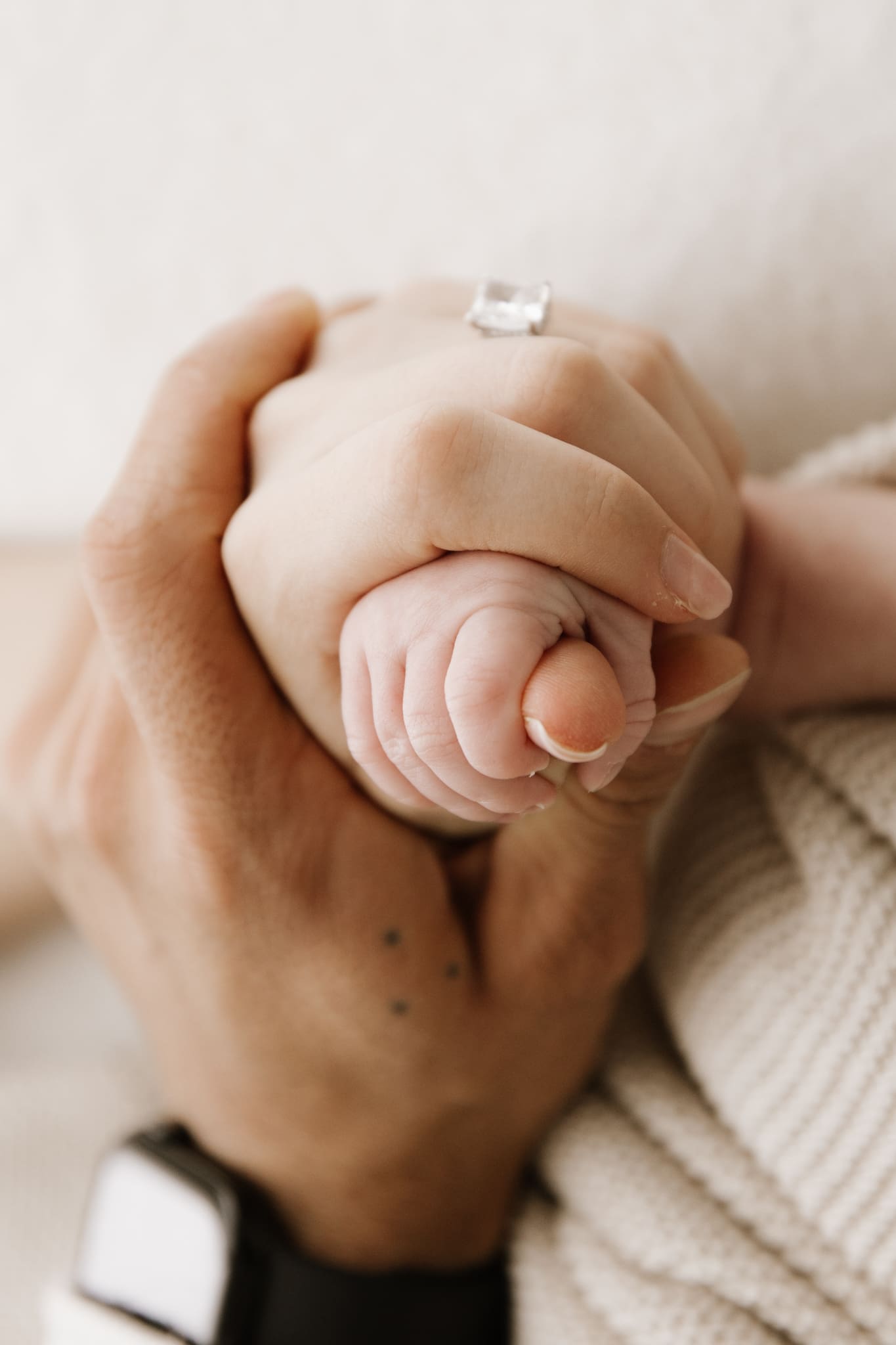close up of newborn baby hand holding parent finger capturing tiny details in Sydney studio